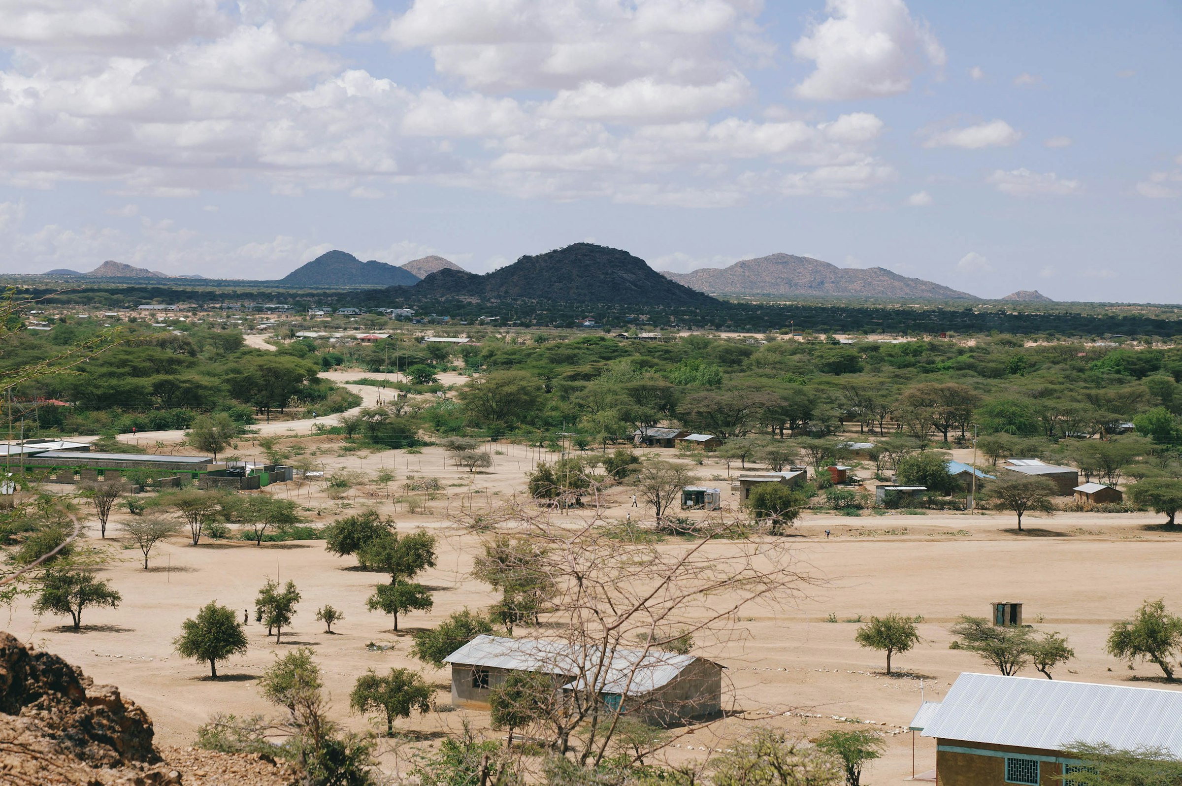 Elevated view of a dry, sparsely vegetated village in Turkana, Kenya