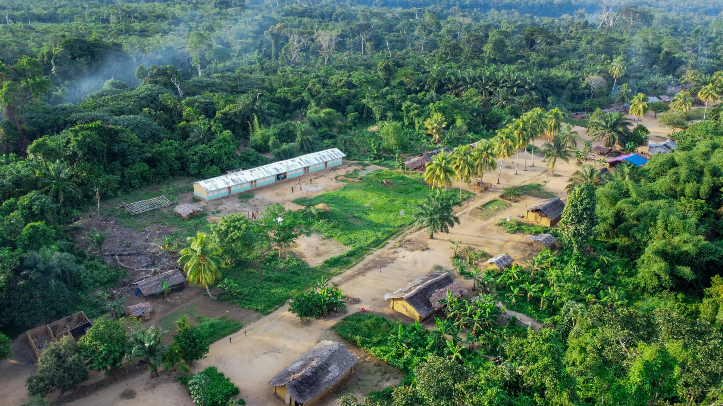 Aerial view of a primary school amid jungle in Yangambi, Democratic Republic of Congo