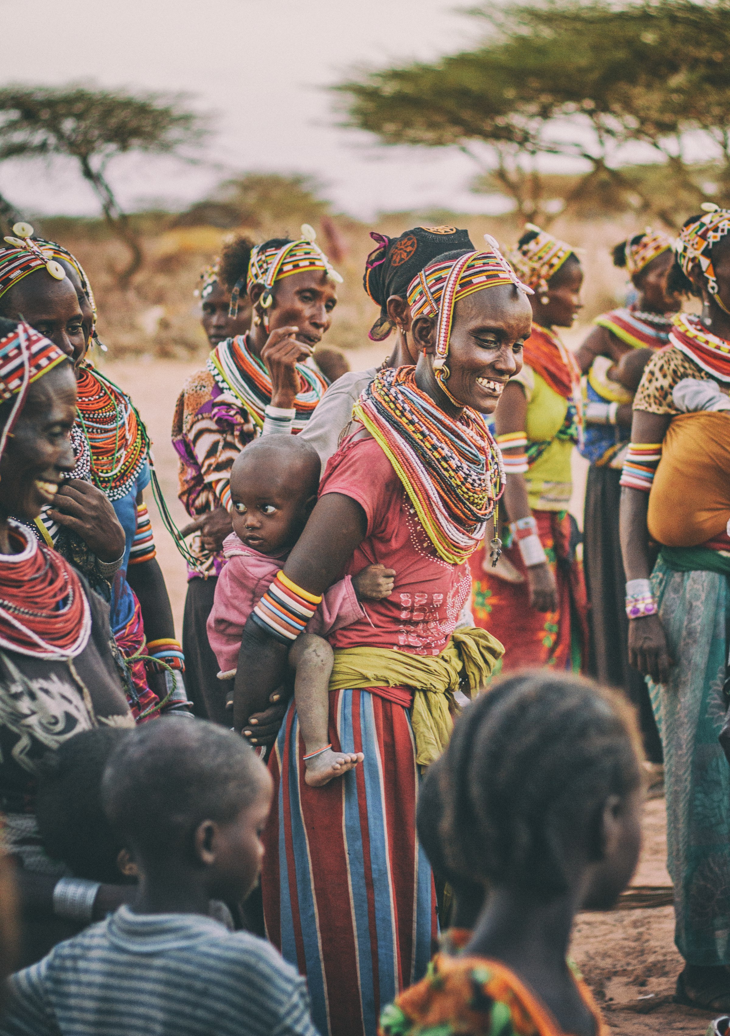 Samburu women and children gathered together in Kargi, a nomadic settlement in Kenya