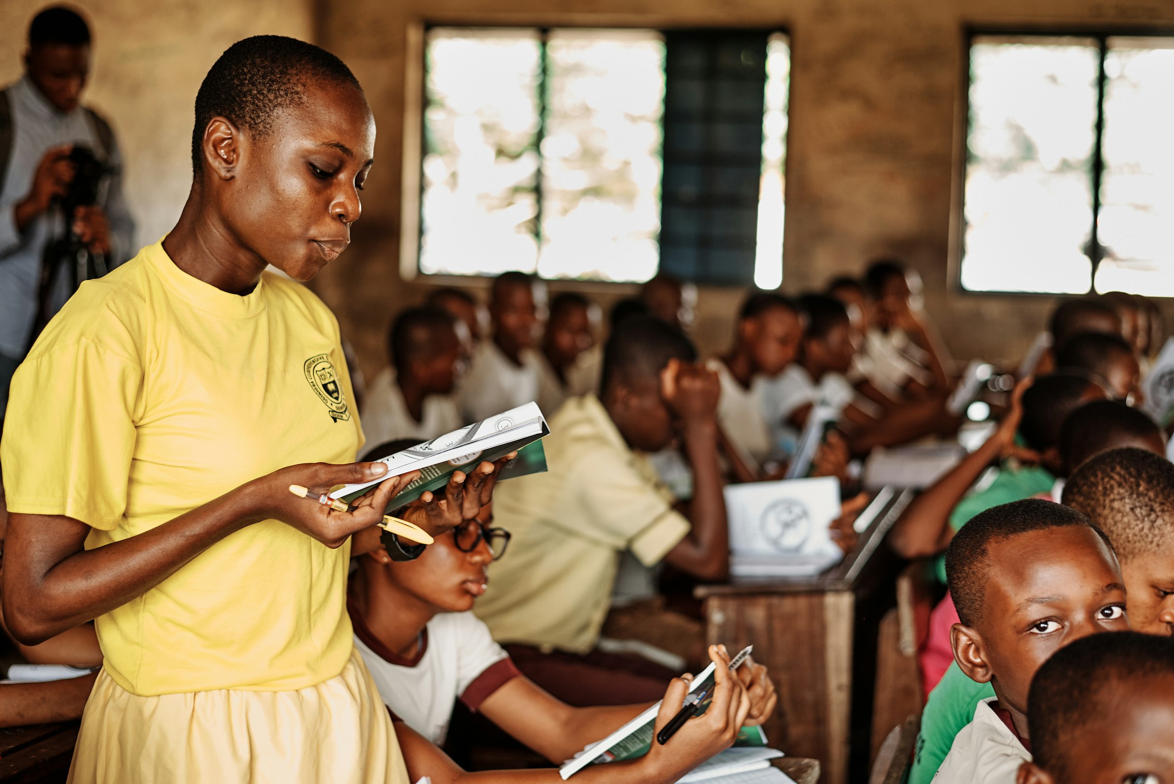 Teacher addressing a group of children at a school in Port Harcourt, Nigeria
