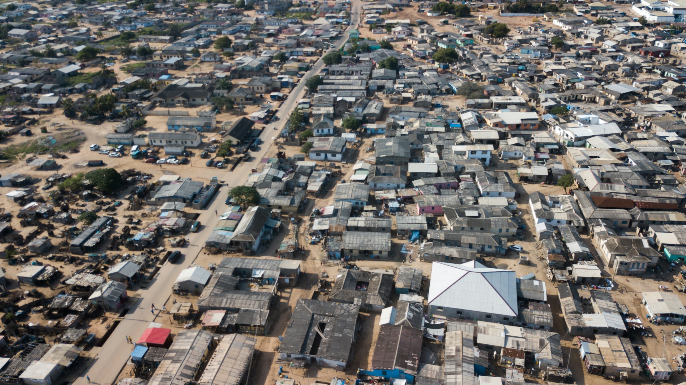 Aerial drone view of a coastal village in Prampram, Ghana