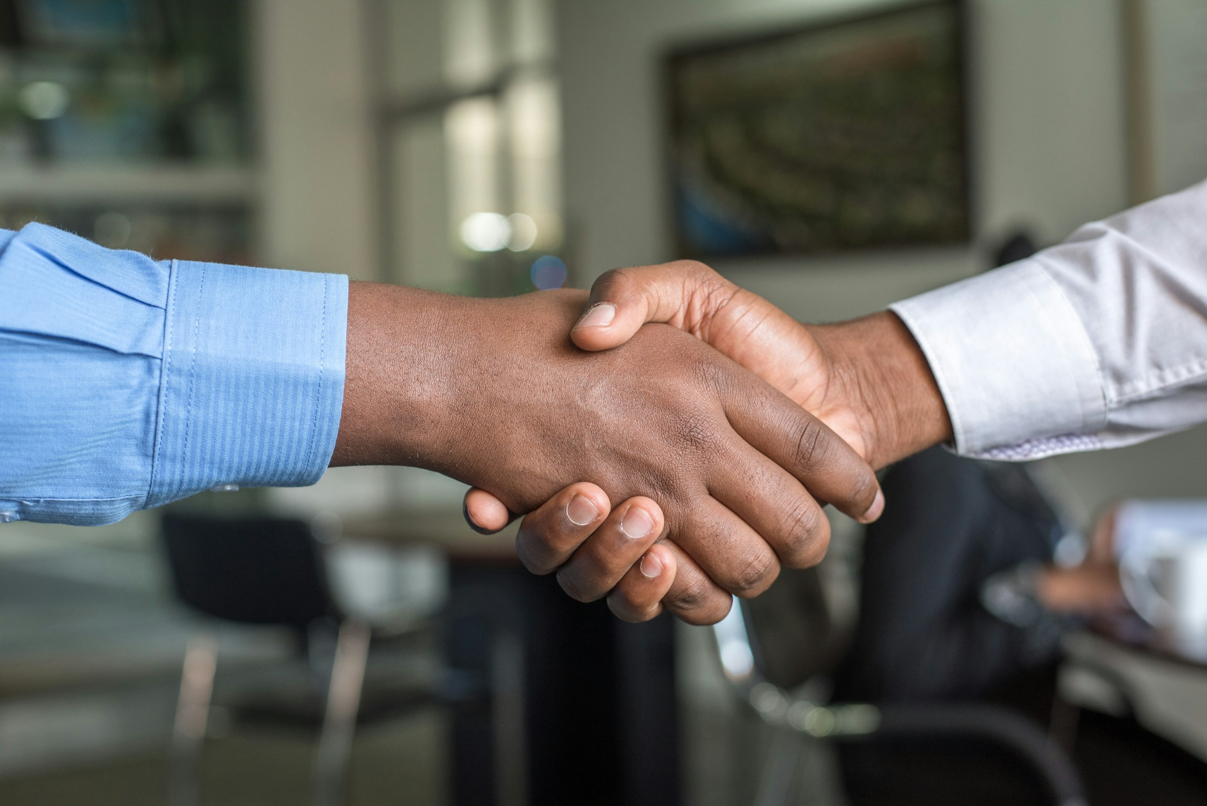 Business handshake between two people in an office in Nairobi, Kenya